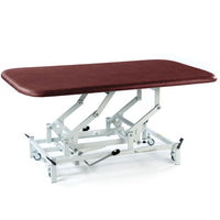 SEERS Medical Hydraulic Therapy Mat Table with white frame and wheels, used for therapy or physio sessions, side view.