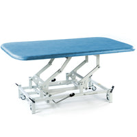Blue therapy mat table with metal frame, wheels, and adjustable height for rehabilitation use, side angle view.