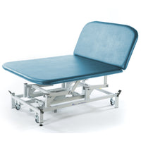 Sky blue electric Bobath therapy couch with adjustable backrest and white frame on wheels, side view.