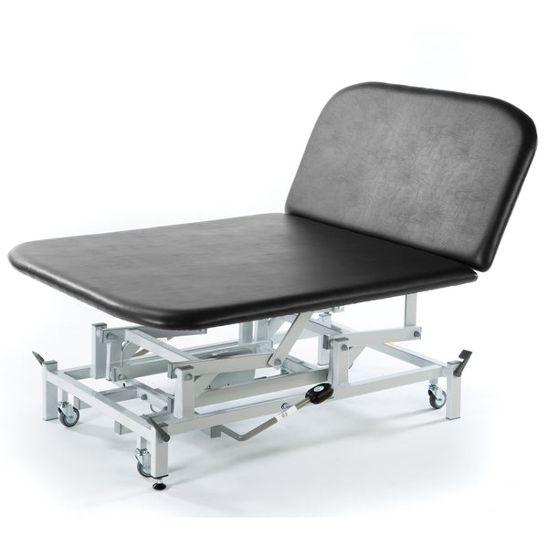 Dark grey hydraulic Bobath therapy couch with wheels, for medical or physiotherapy, side view.