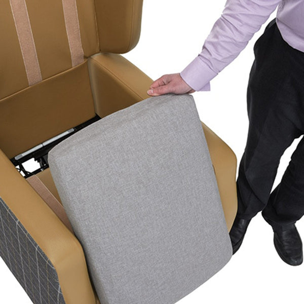 Pressure relief cushion being lifted from Harlem Porter Express Chair by Repose Seating, showing interior detail, in use view.