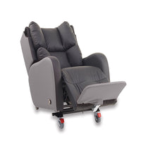 Padded grey porter chair with wheels and an extended footrest, shown from a side angle.
