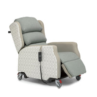 Madison Healthcare Chair with cushioned seat, wheels, and remote control for adjustable comfort, shown from side view.