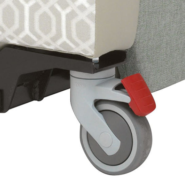Caster wheel with red brake lever on the Repose Seating Madison Healthcare Chair, close-up.