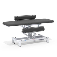 Medi-Plinth Electric Changing Table with MRSA-resistant upholstery, side rails, wheels and adjustable padding, side view.