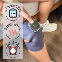 Person using Lifemax 3 in 1 Heated Vibration Massager knee wrap with control display, showing settings and timer, in use view.