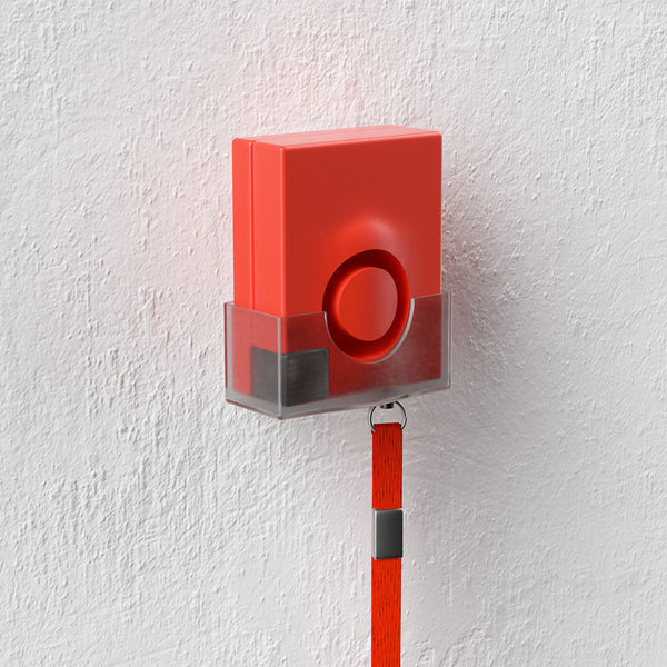 Solon Security 4T Multi-Function Panic Alarm with button and strap mounted on a textured white wall, front view.