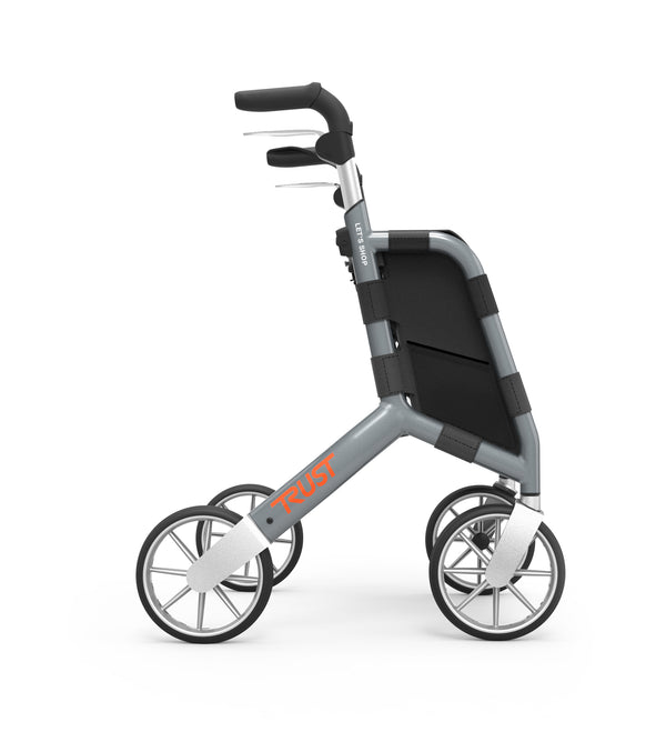 Black rollator walker with four wheels, ergonomic handles and a shopping bag, front view.