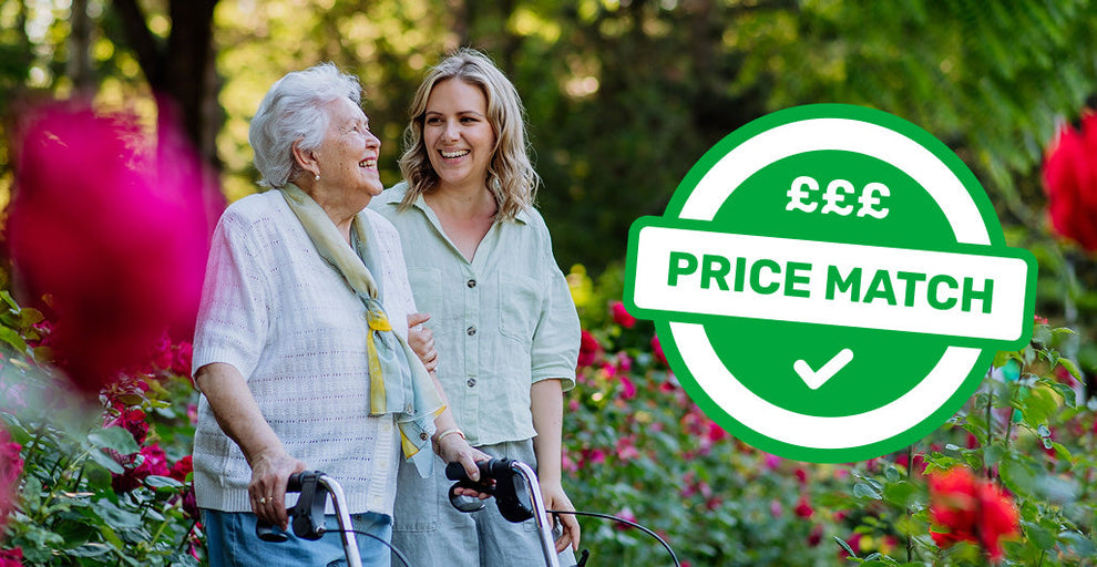 An elderly woman using a walker strolls through a garden full of blooming flowers, accompanied by a younger woman who is smiling beside her. Both appear happy and relaxed. Overlaid on the right side of the image is a large green “Price Match” badge with pound symbols and a checkmark