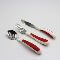 NRS Kura Care Adult Cutlery Set with ergonomic handles on a white background, top view.