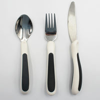 NRS Kura Care Adult Cutlery Set, ergonomic utensils arranged on a white surface, top view.