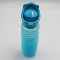 Buckingham Uriwell Unisex Urinal ribbed silicone portable urinal with flip-top lid upright on white background front view.