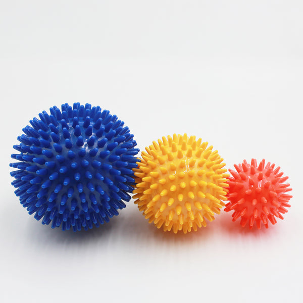 Homecraft Massage Balls in three sizes, arranged side by side for muscle relief use, front view.