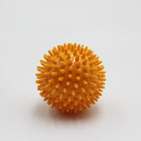 Homecraft Massage Balls with spiky texture for muscle relief, shown on a white background, front view.