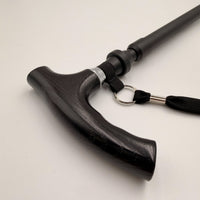 Lifemax adjustable walking stick with curved ergonomic handle and wrist strap, close-up view.