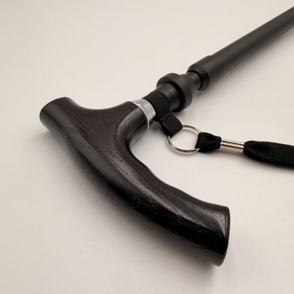 Lifemax adjustable walking stick with curved ergonomic handle and wrist strap, close-up view.