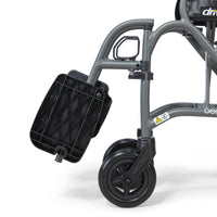 Drive Aero Mg Self Propel Wheelchair front wheel and footrest, white background, close-up.