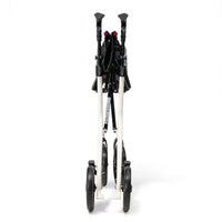 Drive AeroWalk Carbon Rollator in buttercream, folded upright on its wheels, white background, side view.