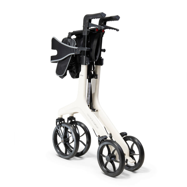 Buttercream Drive AeroWalk Carbon Rollator with four large black wheels and black handles, partially folded, side angle.