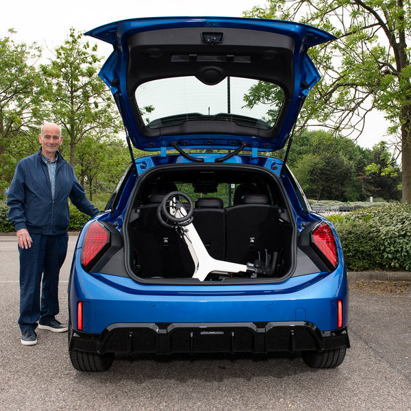 AeroWalk Carbon folded in the back of a car
