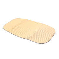 White Aquajoy Saver seat cover with ribbed surface and curved edges, top view.