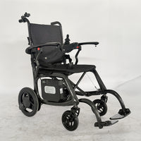 Urathon Velora Carbon Fibre Powerchair with joystick control, padded seat, armrests, footrest and battery, side view.