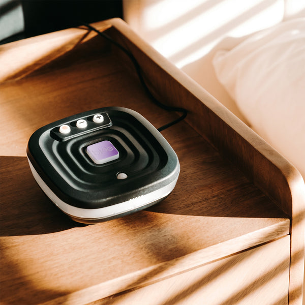 Ravencourt Bide Fall Prevention Device on bedside table, designed to help prevent falls, bedroom setting, side view.