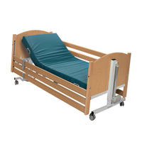 Drive Bradshaw Petite Profiling Bed with wooden side rails and adjustable mattress, partially elevated, side view.