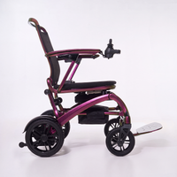 Wizemed C100 carbon fibre folding powerchair with joystick control and raised footrest, side view on white.