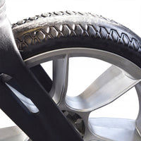 Urathon Cirrus+ Rollator wheel with treaded tyre, metal spokes and adjustable backrest on white background, close-up.
