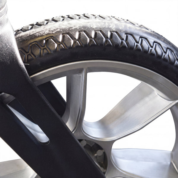 Urathon Cirrus+ Rollator wheel with treaded tyre, metal spokes and adjustable backrest on white background, close-up.