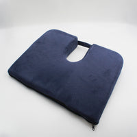 Drive Coccyx Cushion, wedge shape with handle for pressure relief, shown against a white background, angled front view.
