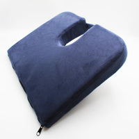 Drive Coccyx Cushion, wedge shape with memory foam, centre cutout and zippered cover on a white background, front angle view.
