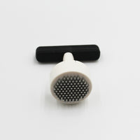 Homecraft Contour Knob Turner with round spiked end and grip handle, on a white surface, close-up view.