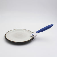Buckingham Coolhand Plate Gripper lifting a ceramic plate, plain background, in use view.