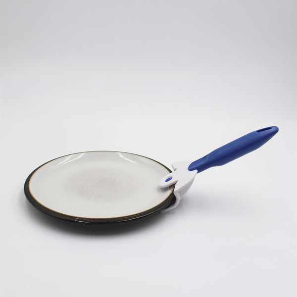 Buckingham Coolhand Plate Gripper lifting a ceramic plate, plain background, in use view.