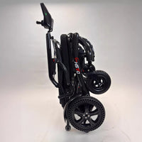 Dash Rehab Dash Carbon Max HD Power Chair with lightweight, compact frame and visible wheels, upright position, front angle.
