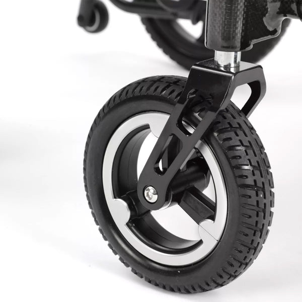 Caster wheel with textured rubber tyre on Dash Carbon Pro Plus Powerchair, close-up.
