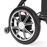 Large spoked wheel and small rear support wheel on Dash Rehab Dash Carbon Pro Plus Powerchair, close-up.