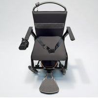 Dash Rehab Dash Lunar Powerchair with seatbelt, armrests, footrest and joystick control, top view on light background.