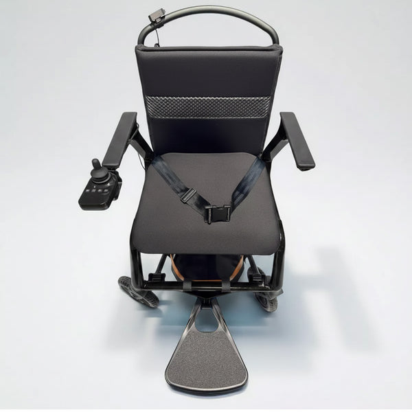 Dash Rehab Dash Lunar Powerchair with seatbelt, armrests, footrest and joystick control, top view on light background.