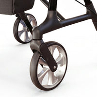 Dash Rehab Dash Swish Carbon Rollator with ergonomic handles, metallic spokes and wheel detail, close-up.