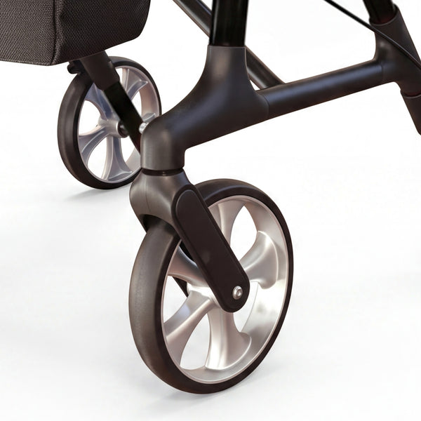 Dash Rehab Dash Swish Carbon Rollator with ergonomic handles, metallic spokes and wheel detail, close-up.
