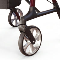 Dash Rehab Dash Swish Carbon Rollator front wheels with black tyres and silver spokes on white background, close-up.