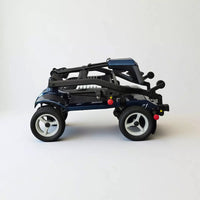 Dash Rehab Dash Z1 folding mobility scooter with large wheels, folded position on white background, side view.