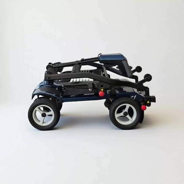 Dash Rehab Dash Z1 folding mobility scooter with large wheels, folded position on white background, side view.