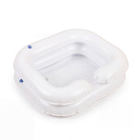 Able2 Deluxe Inflatable Shampoo Basin with open side and rounded edges for hair washing in bed, angled view.