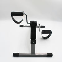 Drive Digital Pedal Exerciser with digital monitor, resistance control and straps for seated cycling or rehab, side view.