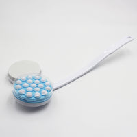Homecraft Dual Function Lotion and Cream Applicator with long handle and round textured head, for massaging or applying lotion, side view.