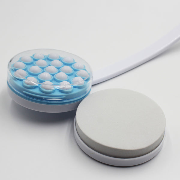 Homecraft Dual Function Lotion and Cream Applicator with long handle, massage head, and round pumice stone, front view.